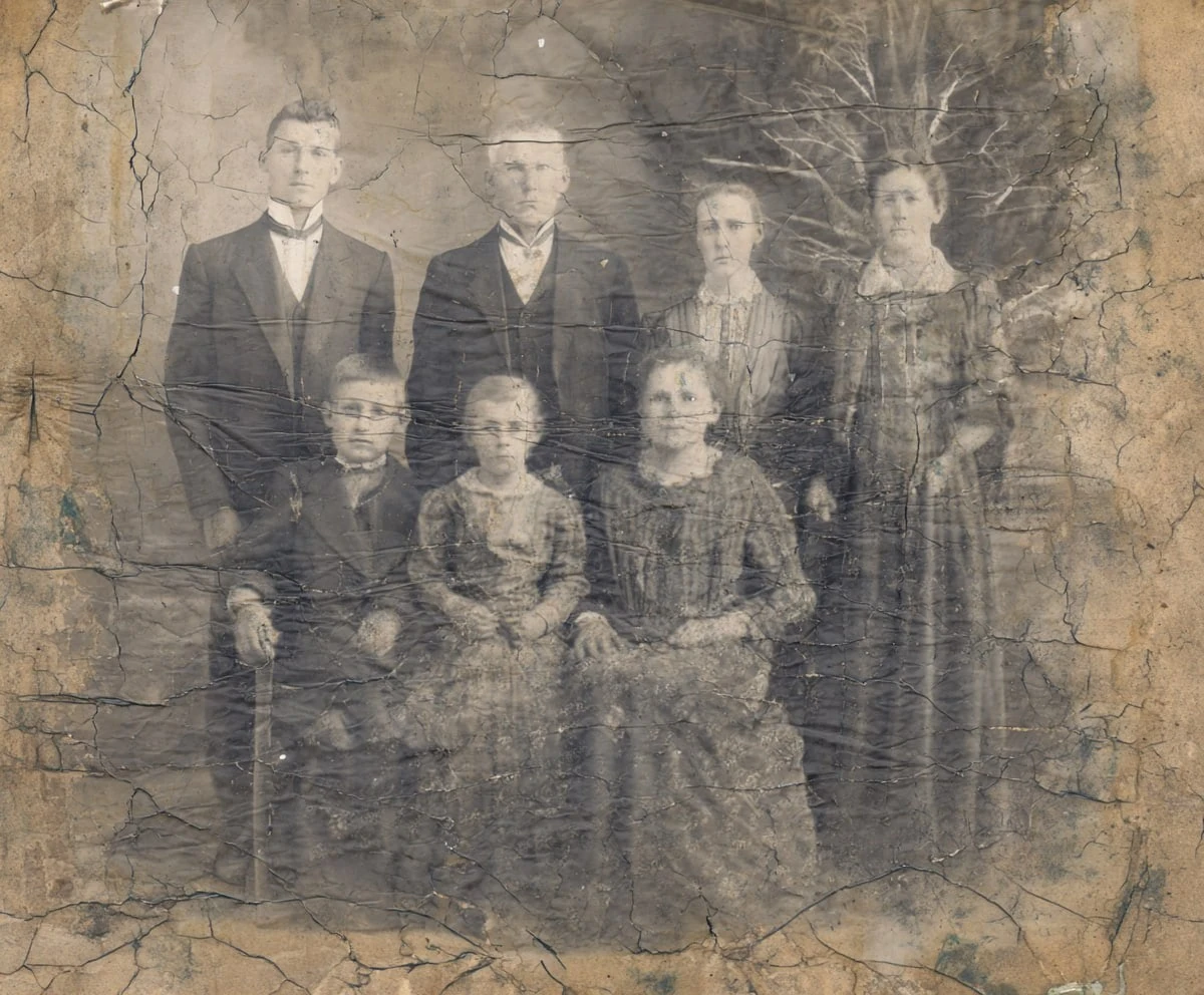 Black-and-white photo of a large family before AI restoration